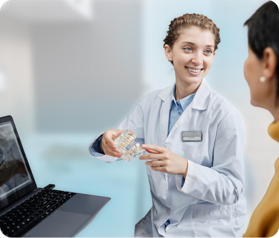 A dentist explaining treatment options to a patient.